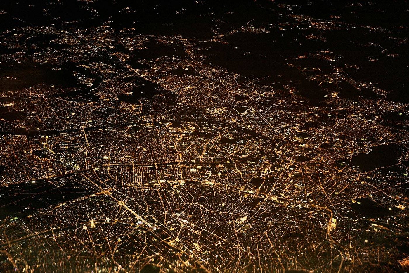 Aerial view of a city lit up at dusk